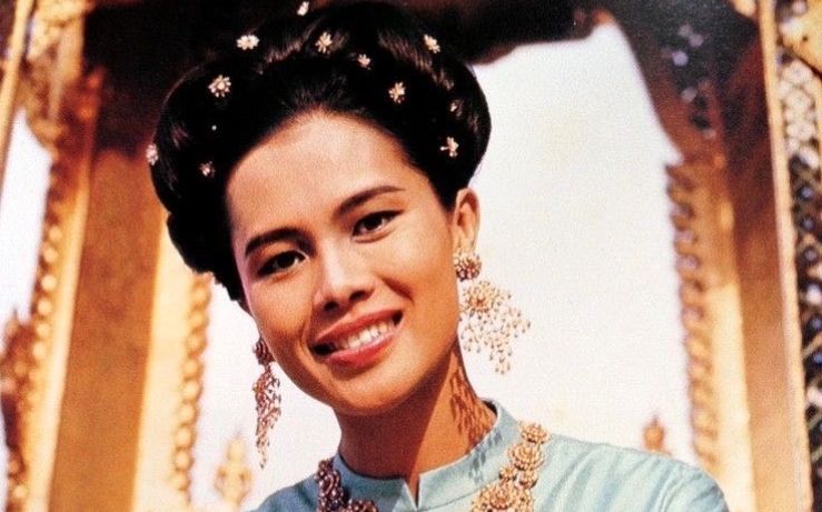 Thailand is in mourning following the death of Queen Mother Sirikit, a royal icon whose grace, philanthropy, and at times controversial influence helped shape the country’s modern monarchy. She passed away at the age of 93, the Thai Royal Household Bureau confirmed on Saturday. Sirikit had been largely absent from public life since suffering a stroke in 2012.As the nation reflects on her seven-decade-long presence at the heart of its national life, a complex and multifaceted legacy emerges.From ‘hate at first sight’ to a 70-year reignBorn in 1932 to a Thai ambassador, Sirikit Kitiyakara grew up in the privileged world of European diplomacy, studying music and languages in Paris. It was there that she met her future husband, King Bhumibol Adulyadej. Their first meeting was not auspicious. <em>(Image source: https://thailand.prd.go.th/)</em>“It was hate at first sight,” she would later recall in a BBC documentary, noting that the young king had arrived late. “Then it was love.”They were married a year later, when Sirikit was just 17. As queen consort, she stood beside Bhumibol for his entire 70-year reign, becoming a beloved figure through their extensive charitable work and high-profile international tours.A global style icon with a purposeSirikit was renowned for her elegance and impeccable fashion sense. During a landmark 1960 visit to the United States, Time magazine described her as “svelte” and “archfeminist.”<em>(Image source: https://thailand.prd.go.th/)</em>She famously collaborated with the French couturier Pierre Balmain, commissioning outfits made from traditional Thai silk. The partnership was a stroke of genius, helping to revitalize the domestic silk industry and preserve traditional weaving techniques.Her glamour always had a purpose. For over four decades, she accompanied the king on televised visits to remote villages, promoting development projects for the rural poor and cementing her image as a compassionate, maternal figure.Her birthday, August 12, was designated as Thailand’s official Mother’s Day in 1976.A quiet but powerful political influenceWhile the Thai monarchy is officially above politics, Sirikit was not afraid to exercise her considerable influence at key moments. In 1956, she served briefly as the nation’s regent. Decades later, in 1998, she used her birthday address to urge the public to support the sitting prime minister, a move that successfully undermined an opposition effort to oust him.She later became associated with the royalist “Yellow Shirt” protest movement, and in 2008, she attended the funeral of a protestor who had been killed in clashes with police, a powerful and public signal of royal backing for the movement.An enduring and revered legacyFor many Thais, Queen Mother Sirikit will be remembered as a symbol of grace, national pride, and maternal virtue. Her passing will be marked with deep reverence in a country where strict lese-majeste laws make any criticism of the monarchy, past or present, a serious criminal offense.She leaves behind her son, the current King Maha Vajiralongkorn, and a legacy that is as complex as the modern nation she helped to shape.The post <a href="https://invezz.com/news/2025/10/25/a-billion-dollar-monarchy-how-queen-mother-sirikit-put-thai-silk-on-the-global-stage/">A billion-dollar monarchy: How queen Sirikit put Thai silk on the global stage</a> appeared first on <a href="https://invezz.com/">Invezz</a>